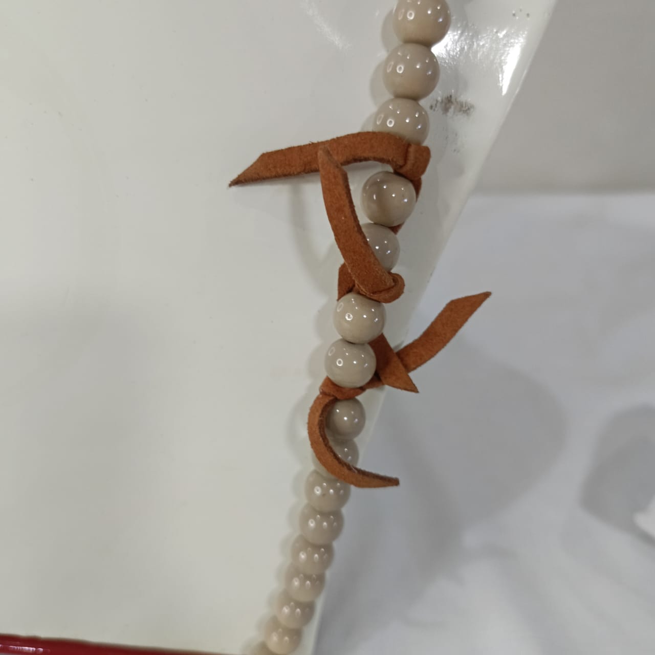 سلسلة طولة بقلادة دمية