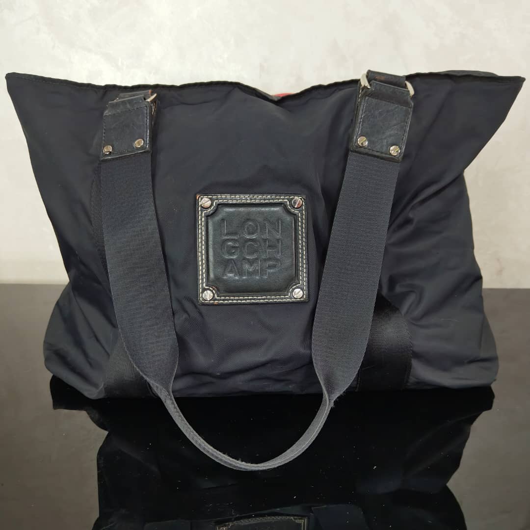 Sac Longchamp en toile femme original 
45/30cm
Prix 12000