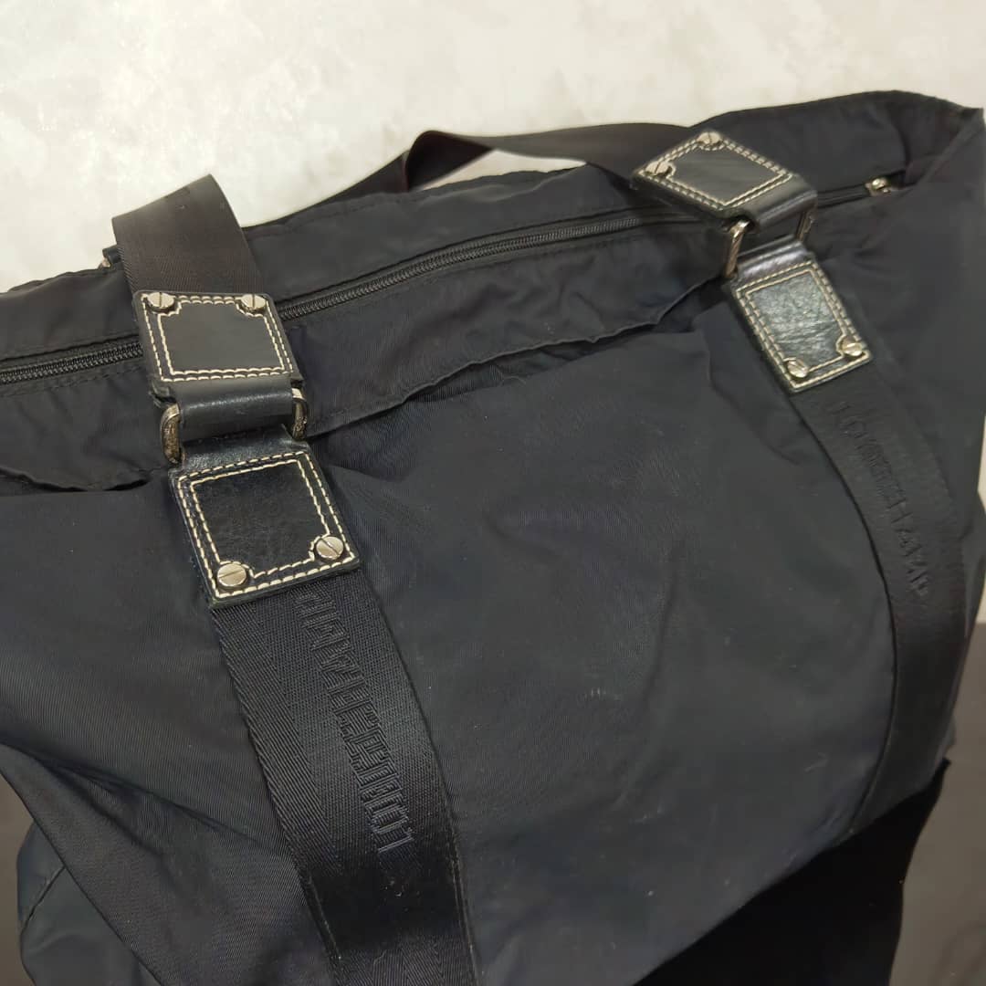 Sac Longchamp en toile femme original 
45/30cm
Prix 12000